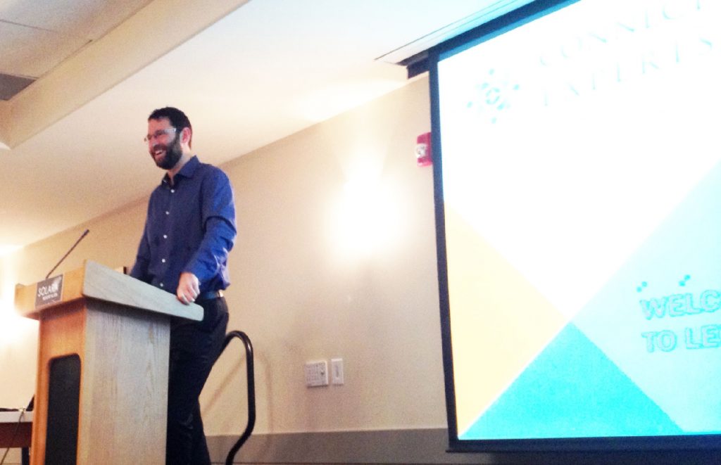 Paul Cahill a a podium at a conference