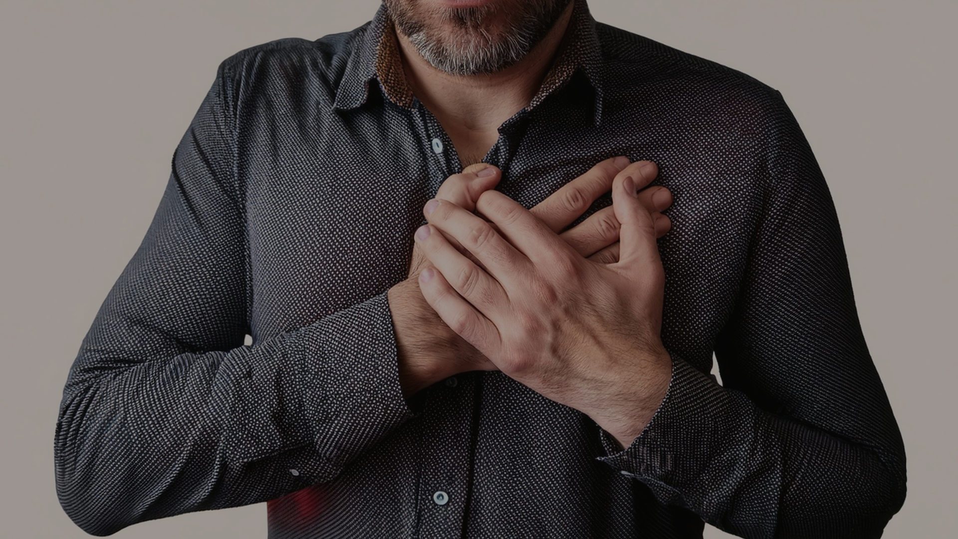 Man Holding Chest Due to Heart Attack