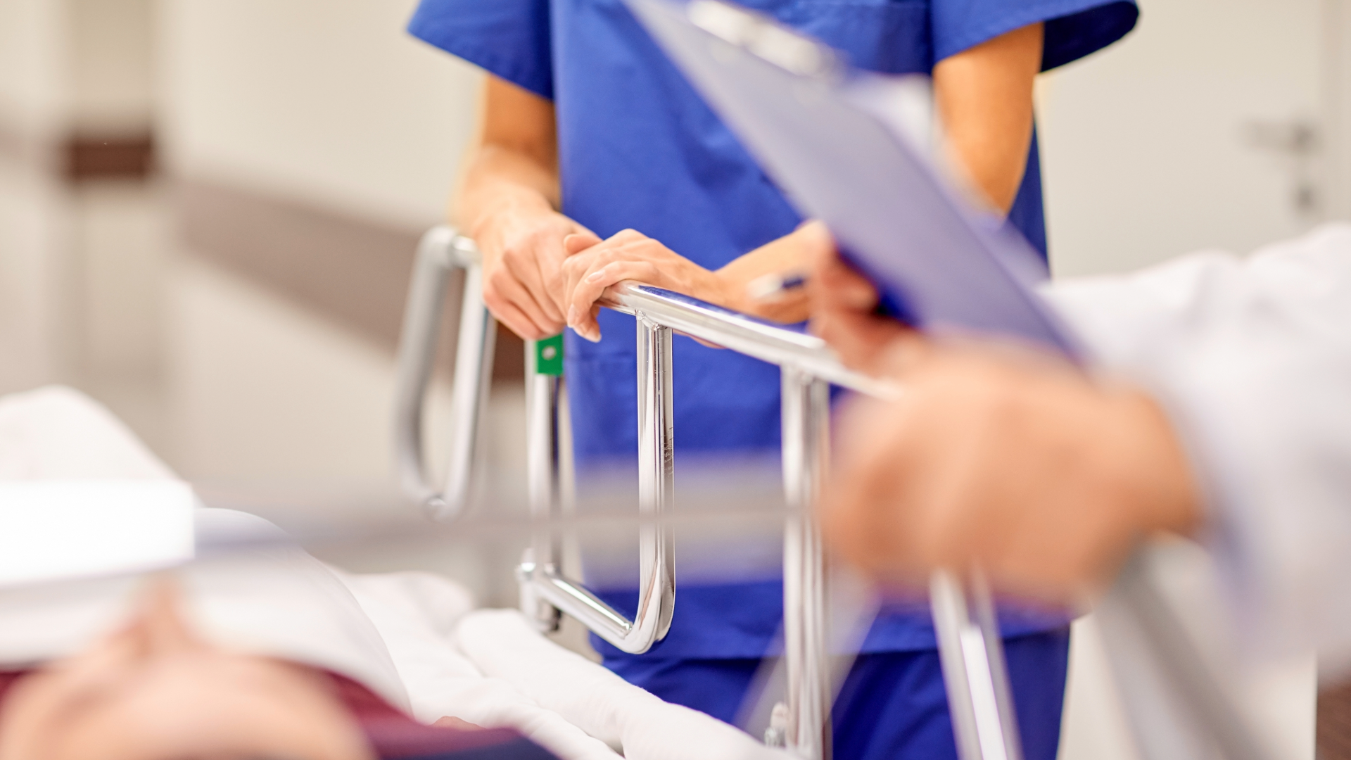 Patient on Stretcher in Hospital Emergency Room | Paul Cahill Medical Malpractice Lawyer Nurse and physician attending to a patient on a stretcher in a hospital emergency department, illustrating hallway medicine in Ontario.